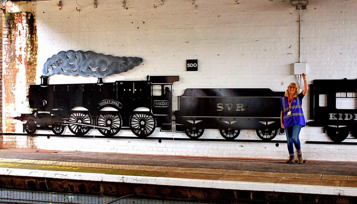 Sue Langley with the heritage rail artwork at Kidderminster Station