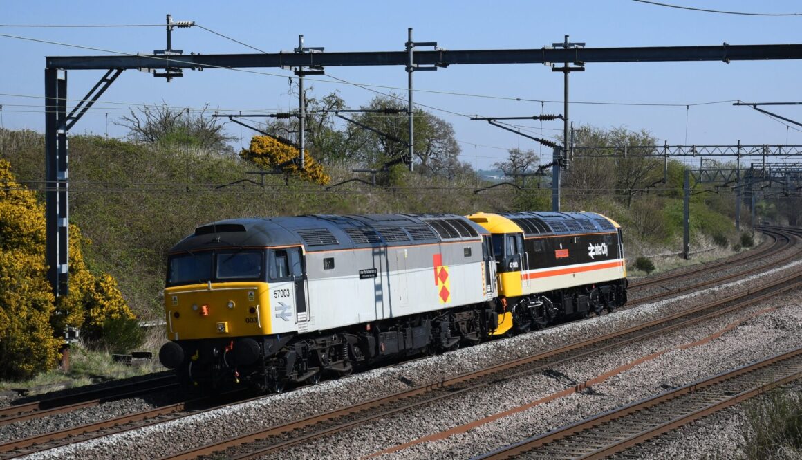 57003 and 47593 pass Heamies Farm as 0Z48 Eastleigh Arlington to Crewe H.S. on 10/04/2025. Brad Joyce, 9 Coalport Drive, Stone, Staffs. ST15 0XU.