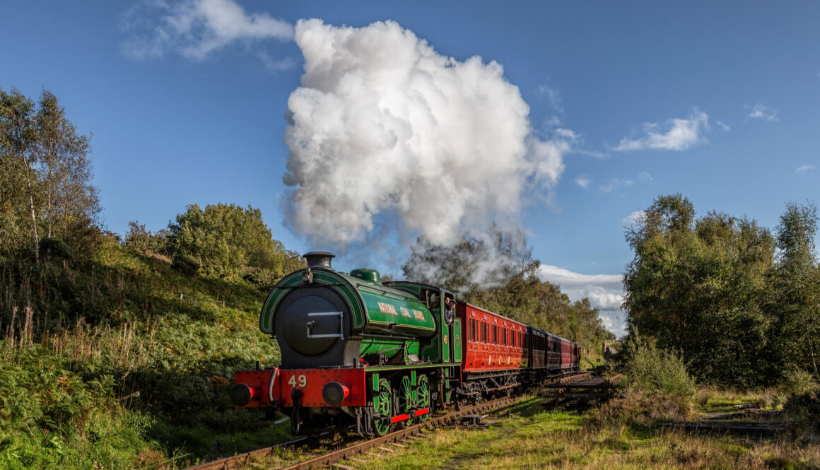 Steam locomotive N.C.B No.49 with a colliery passenger train steaming along the Tanfield Railway the Worlds Oldest Railway in North-East England